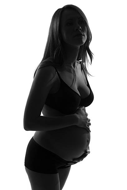 istock Pregnant woman with hands over tummy 477726785