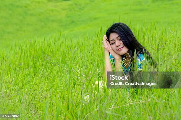 Lovely Woman Daydreaming At Field Stock Photo - Download Image Now - 2015, Adult, Adults Only