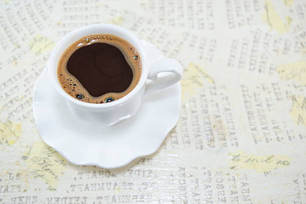istock Cup of coffee on a decoupage table 477727144