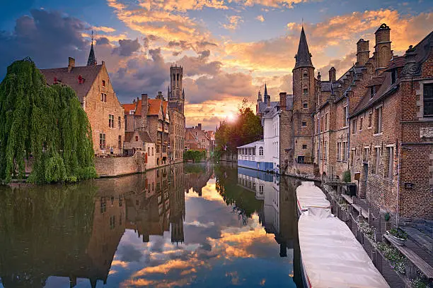 Image of famous most photographed location in Bruges, Belgium during dramatic sunset.