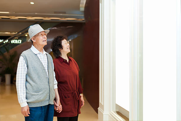 Senior couple looking at blank frame