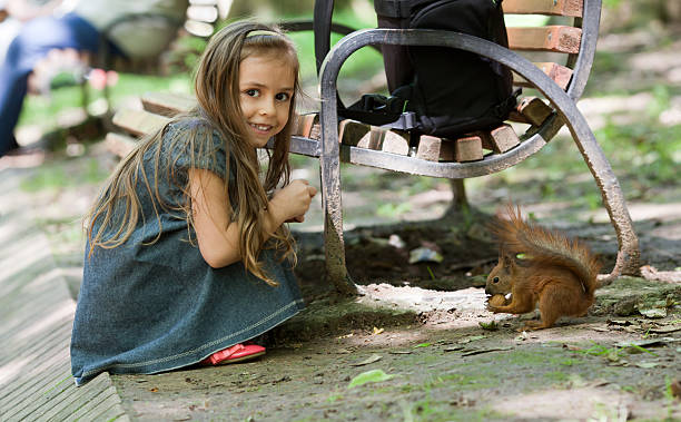 Little girl with squirrel
