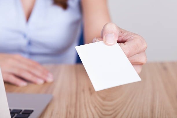 istock Businesswoman offering her card 477728542