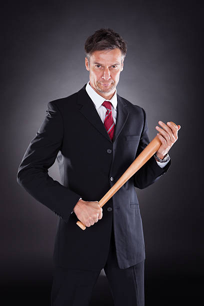 istock Businessman Holding Baseball Bat 477728662