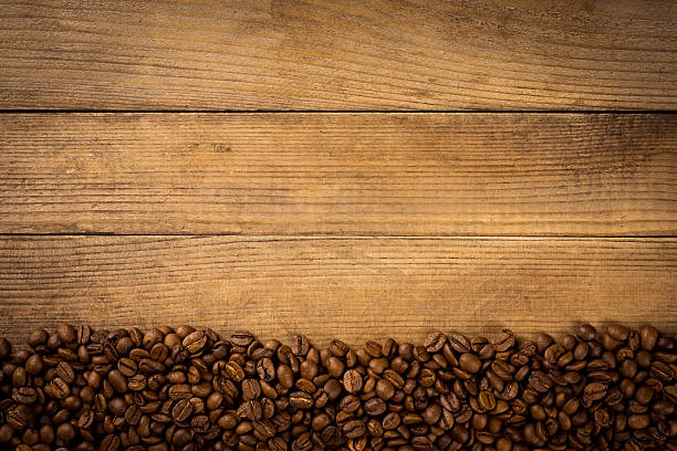 istock Coffee beans on the brown background 477728944