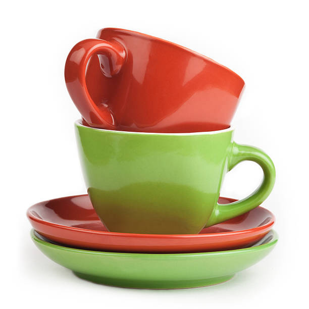 istock stack of red and green tea cups and saucers 477729227