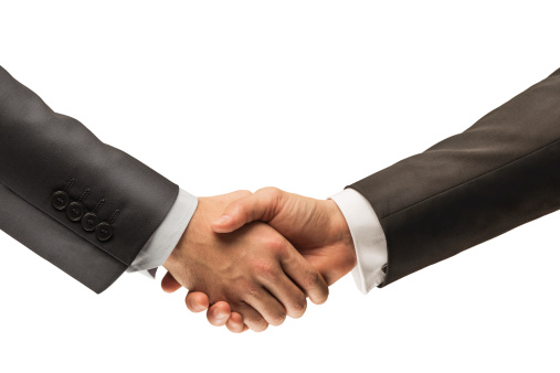 Businessmen handshake close-up.