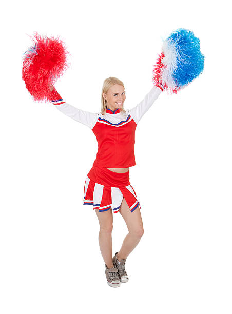 istock Smiling beautiful cheerleader with pompoms. 477729278