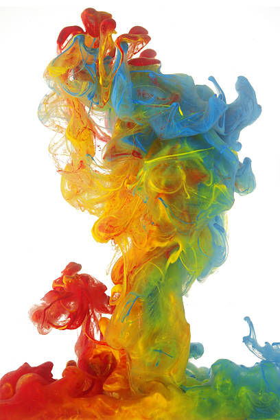 istock Clouds of bright colorful ink mixing in water 477731870