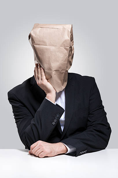 istock Man with paper bag on his head 477732427