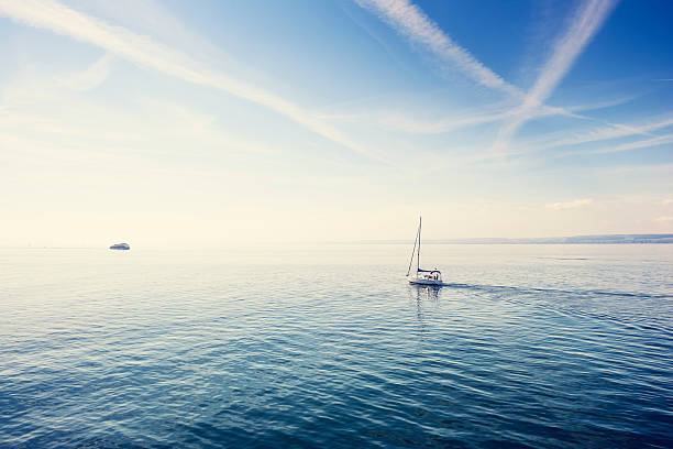 Lonely sailboat on the Constance Lake (Bodensee). stock photo
