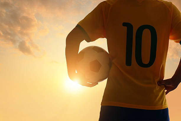 silueta hombre y de fútbol - championship 2014 brazil brazilian fotografías e imágenes de stock