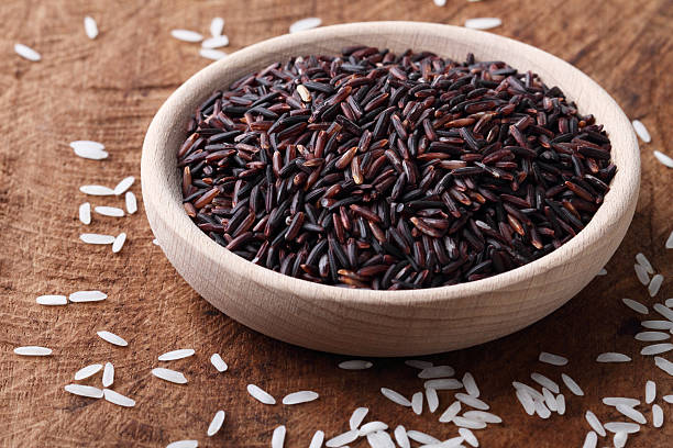 istock jasmine rice in a wooden bowl 477737162