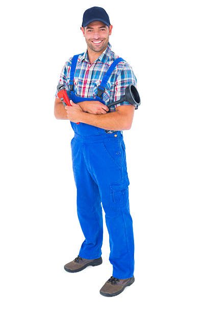 istock Male plumber holding plunger and wrench 477737184