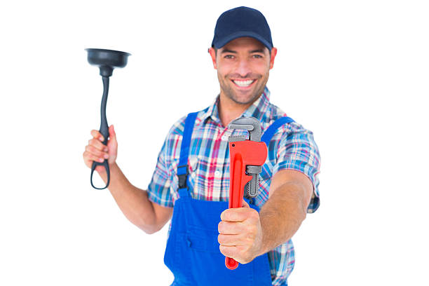 istock Handyman holding plunger and wrench on white background 477737192