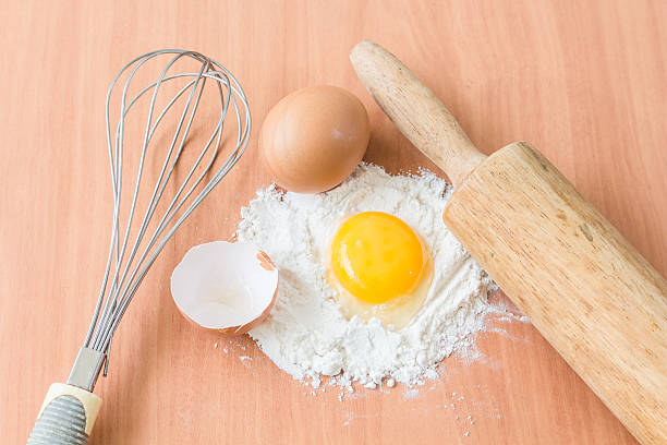 istock Ingredients for baking cake with egg on a wooden worktop 477740064