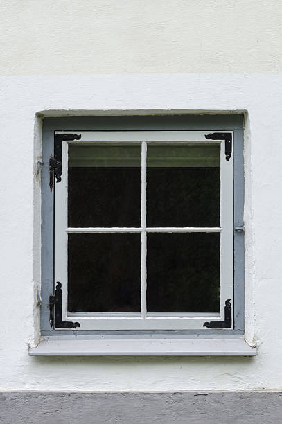 istock Old style vintage window in concrete house 477743104