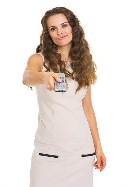 istock Unhappy young woman switching channels with tv remote control 477745011