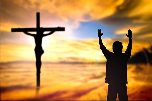 istock Silhouette of man with raised hands 477746552