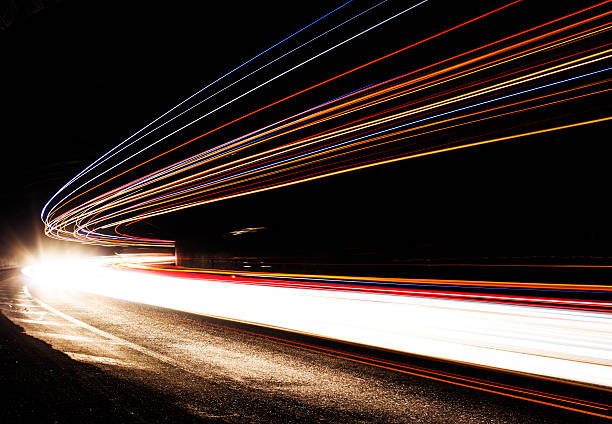 istock Car light trails in the tunnel 477749283