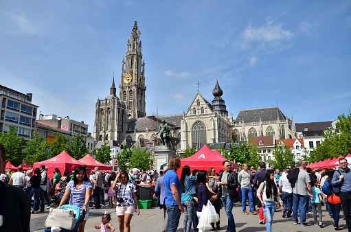 Antwerp, Belgium - May 10, 2015: People visit Thailand Festival at Groenplaats, the Central Square of Antwerp, Belgium, with the Statue of Rubens and Cathedral of Our Lady. on May 10, 2015.