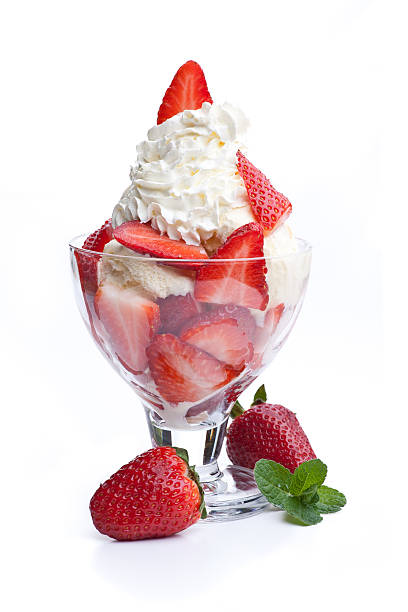 strawberry sundae topped with whipped cream real edible icecream, real strawberries, no artificial ingredients used! fruit garnish stock pictures, royalty-free photos & images
