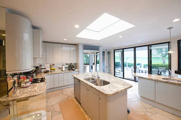 View of marble topped worktop units in modern kitchen at home