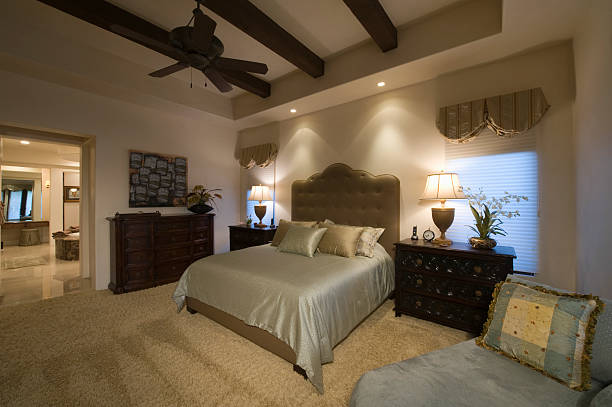 istock Spacious Bedroom With Beamed Ceiling At Home 477754425