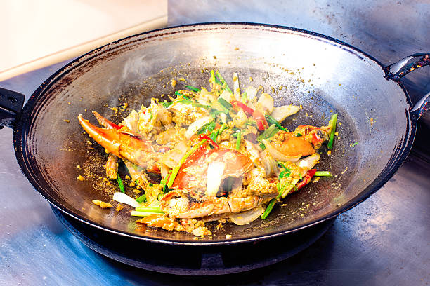 Stir fried crab with curry powder in pan