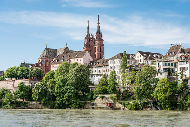 Basel Cathedral View up to the cityscape of Basel with its famous red sandstone cathedral. basel switzerland photos stock pictures, royalty-free photos & images