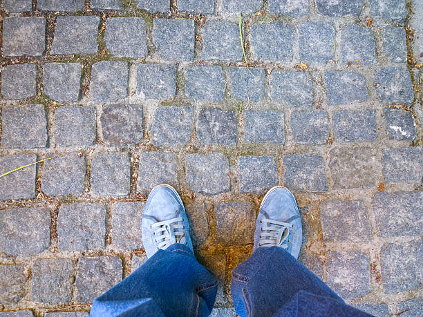 istock Feet on the cobblestone. 477755502