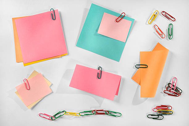 istock Blank colorful paper notes and colorful paper clips, white background. 477756947