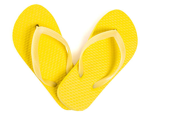 yellow beach flip flop shoes isolated on white background