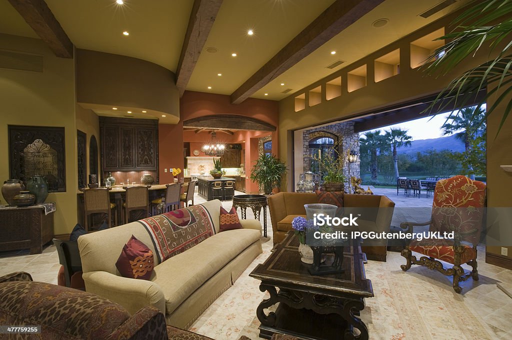 Interior View Of Modern House Living room with dining and kitchen area in background at modern home Home Interior Stock Photo