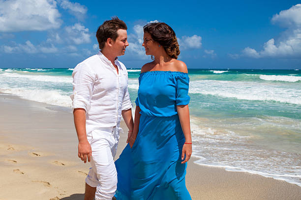 istock Beach couple walking on romantic travel. 477759404