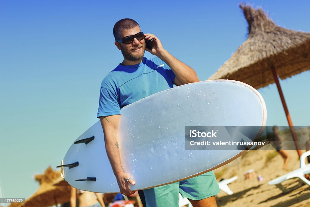 Surfer Surfer - focus on the surfboard 25-29 Years Stock Photo