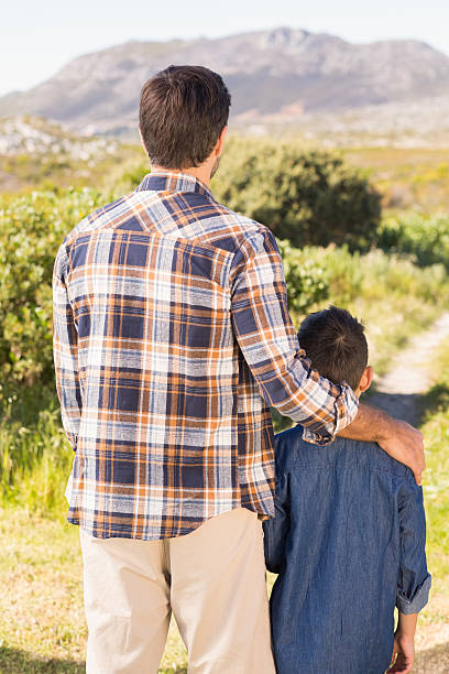 istock Father and son on a hike together 477761512