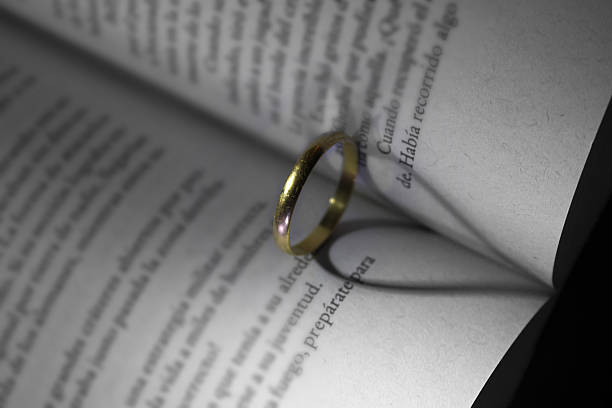 istock gold ring and book a romantic heart forming 477765463