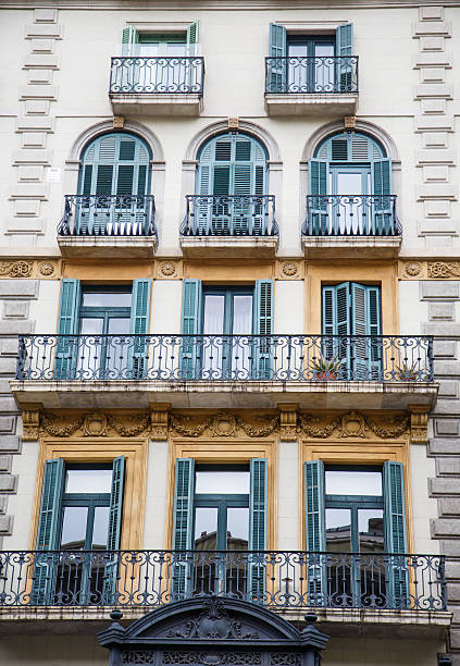 istock Green Shutters and Black Wrought Iron Balconies 477765623