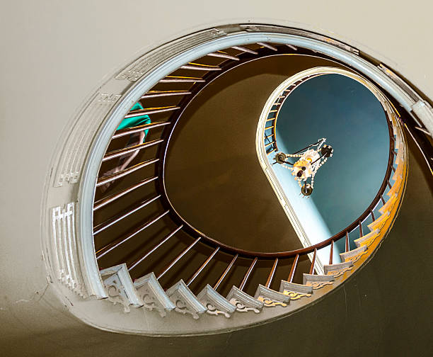 Spiral stairs to upper bedrooms and parlors
