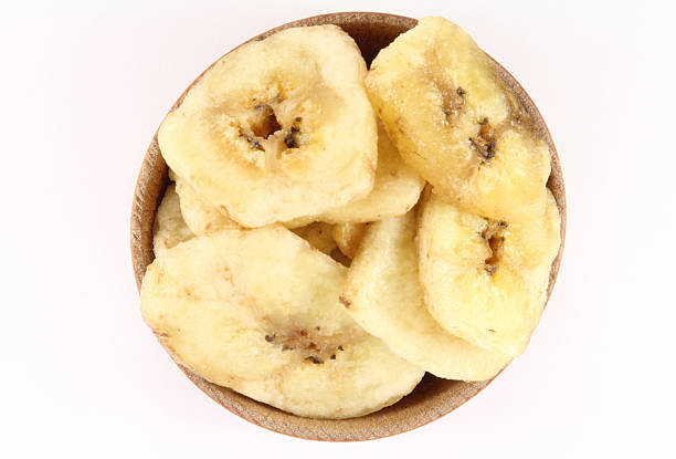 istock Banana chips in a wooden circular shape 477769936