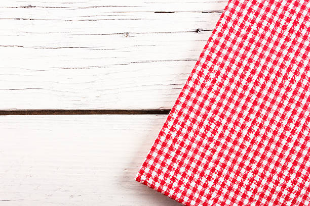 istock red checkered tablecloth on a white wooden board 477770048