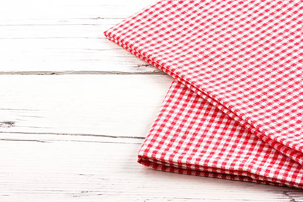 istock red checkered tablecloth on a white wooden board 477770054