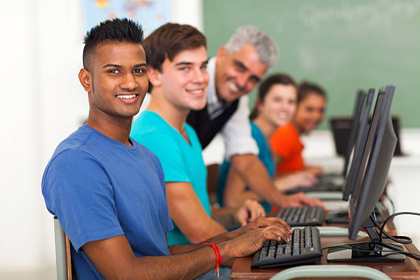 istock group of students and teacher looking at the camera 477771711