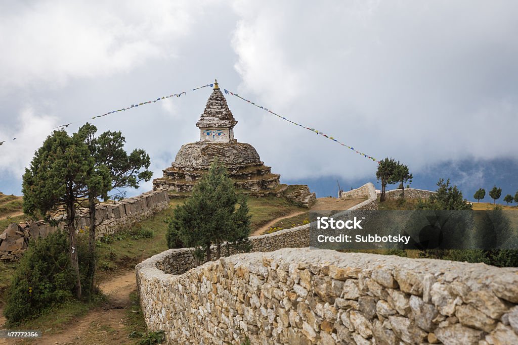 Nepali buddhist stupa. Buddhist stupa building high in Himalaya mountains clouds, Nepal. culture. 2015 Stock Photo