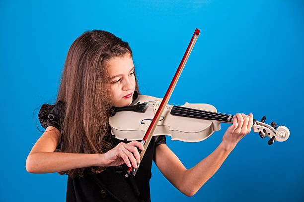 istock Female child playing the violin 477772843