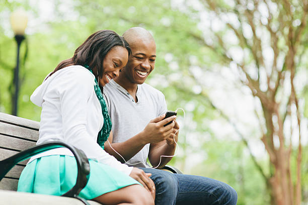 istock Loving Young Couple using Smartphone 477773099