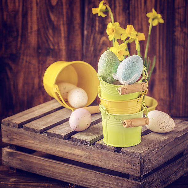 Colorful Easter eggs on wooden background. They can be painted in various colors and can be given on Easter or springtime. Decorating Easter Eggs is fun and creative activity which you can do with your family. Colored Easter Egg is a universal symbol of Easter.