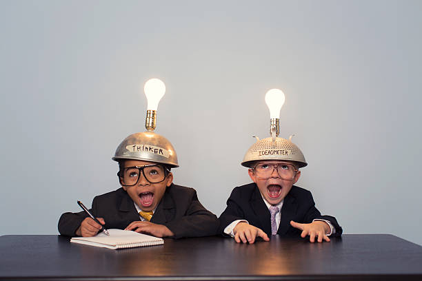 istock Two Young Boy Dressed in Suits and Thinking Caps 477773181