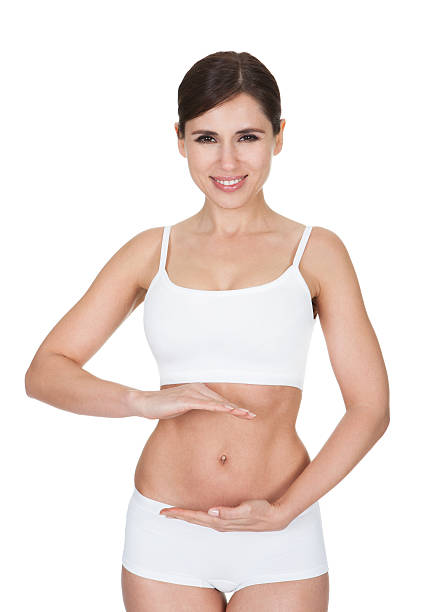 istock Young Woman Gesturing In Front Of Belly 477773588